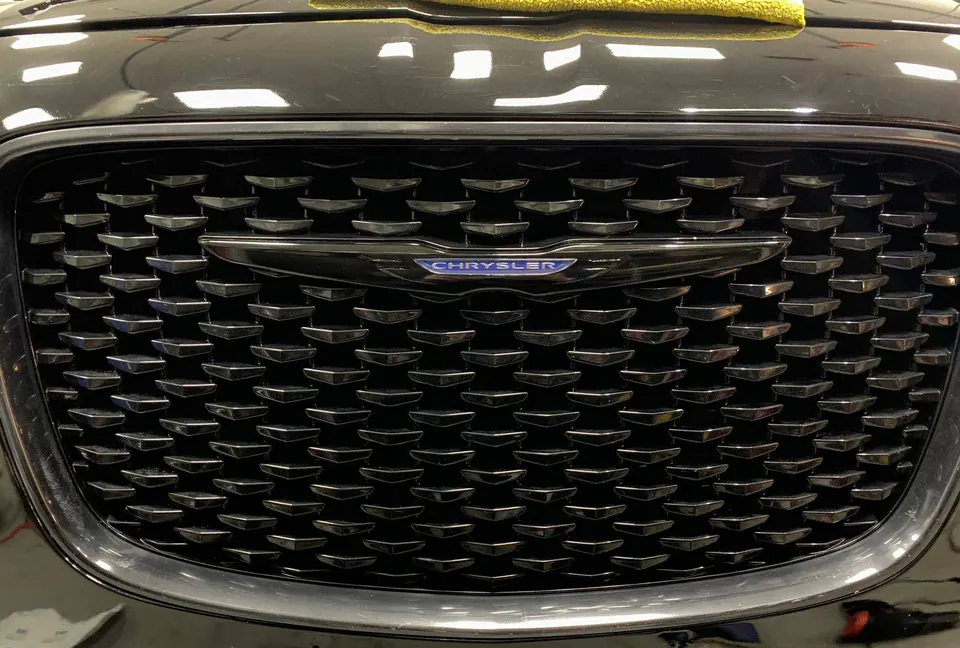 Chrysler 300 grille after a chrome delete, all gloss black