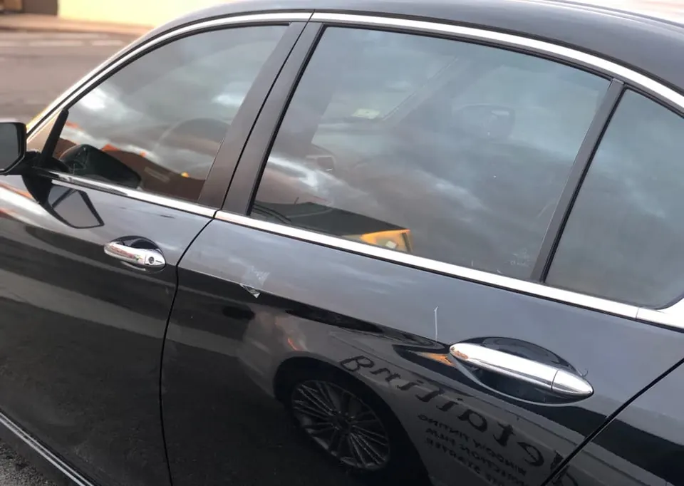 The same sedan after window tint: darker glass, private cabin